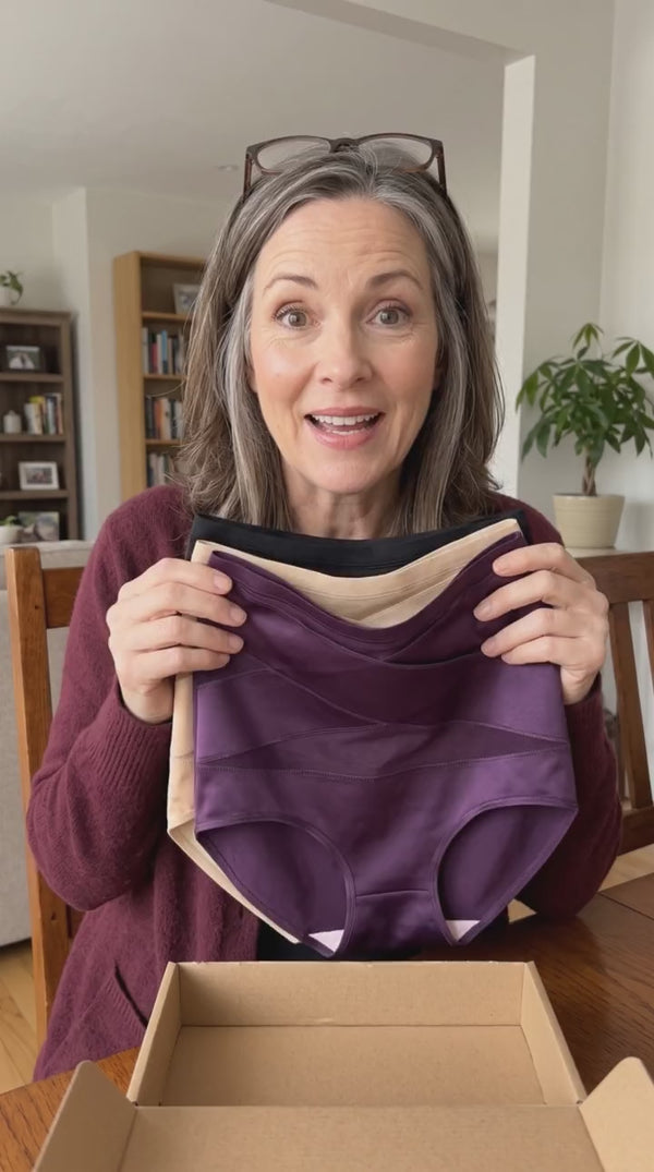 Customer unboxing a 3-pack of briefs
